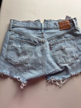 501 Levi's Light Blue Distressed Denim Cutoff Shorts
